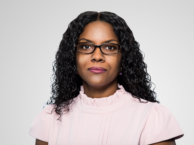 Michelle Frett Mathavious Harneys front portrait image on a grey background