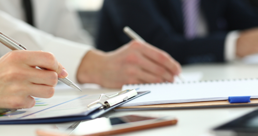 Directors signing important documents