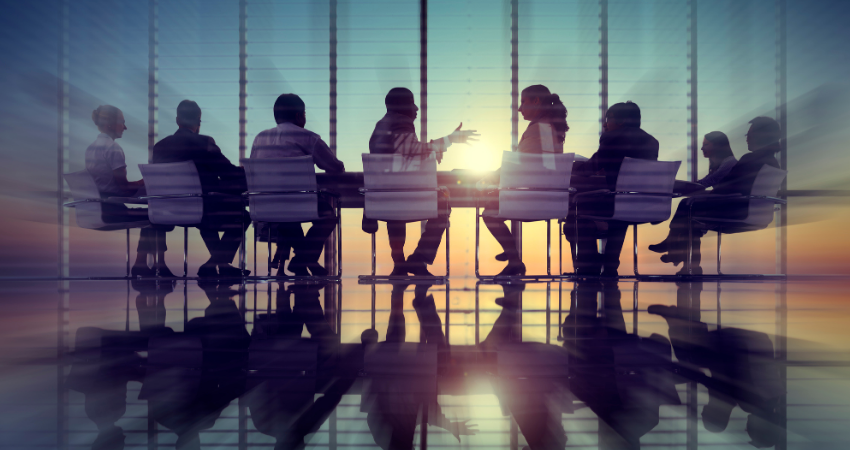 Business people talking in a board room