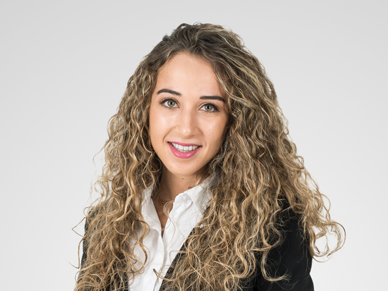 Iphigenia Georgiou Harneys front portrait image on a grey background