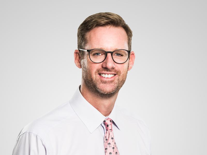 Colin Riegels Harneys front portrait image on a grey background